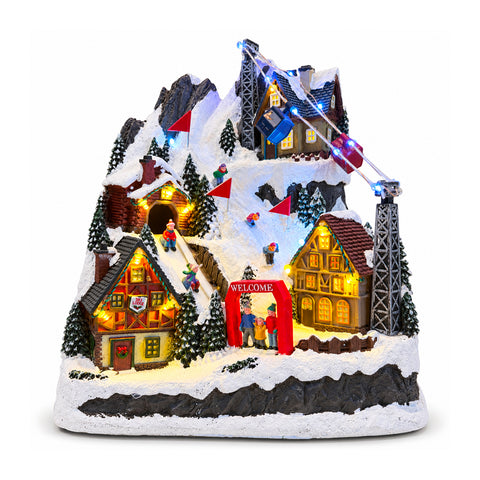 Pueblo navideño luminoso con tobogán en movimiento, teleférico, luces LED y música navideña – 28x19x32 cm