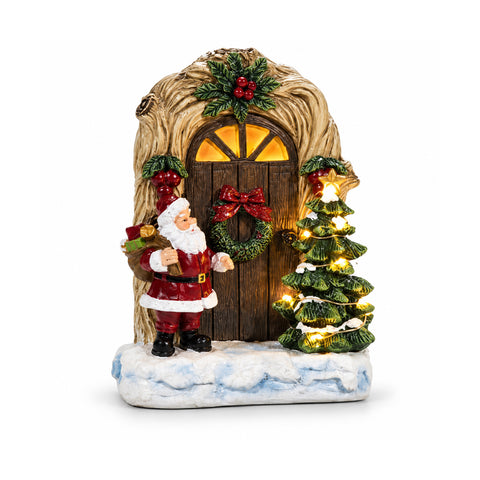 Papá Noel luminoso a pilas con puerta y arbolito H19 cm