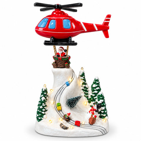 Paisaje navideño con Papá Noel volando, luces LED y música