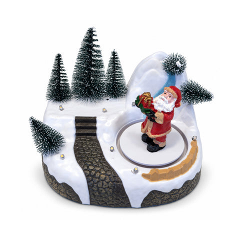 Pueblo navideño luminoso con elemento giratorio, luces LED y música – 3 variantes: árbol, Papá Noel, niños – 17x14x15 cm