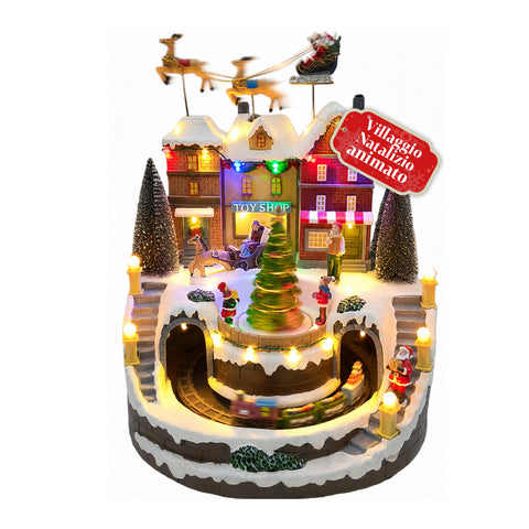 Pueblo navideño luminoso Xmas Town a pilas con luces LED, música, árbol giratorio, trenecito en movimiento y trineo de Papá Noel, 27x25x34 cm