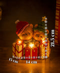 saint joy orsetto natalizio in poliresina con pacco regalo 2 varianti luci led puntuali alimentazione a batterie finiture curate base stabile ean 8050043127846